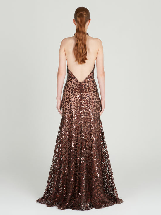A brown Terni Dress Bronze Night Bloom with bronze sequin detailing on a mannequin.