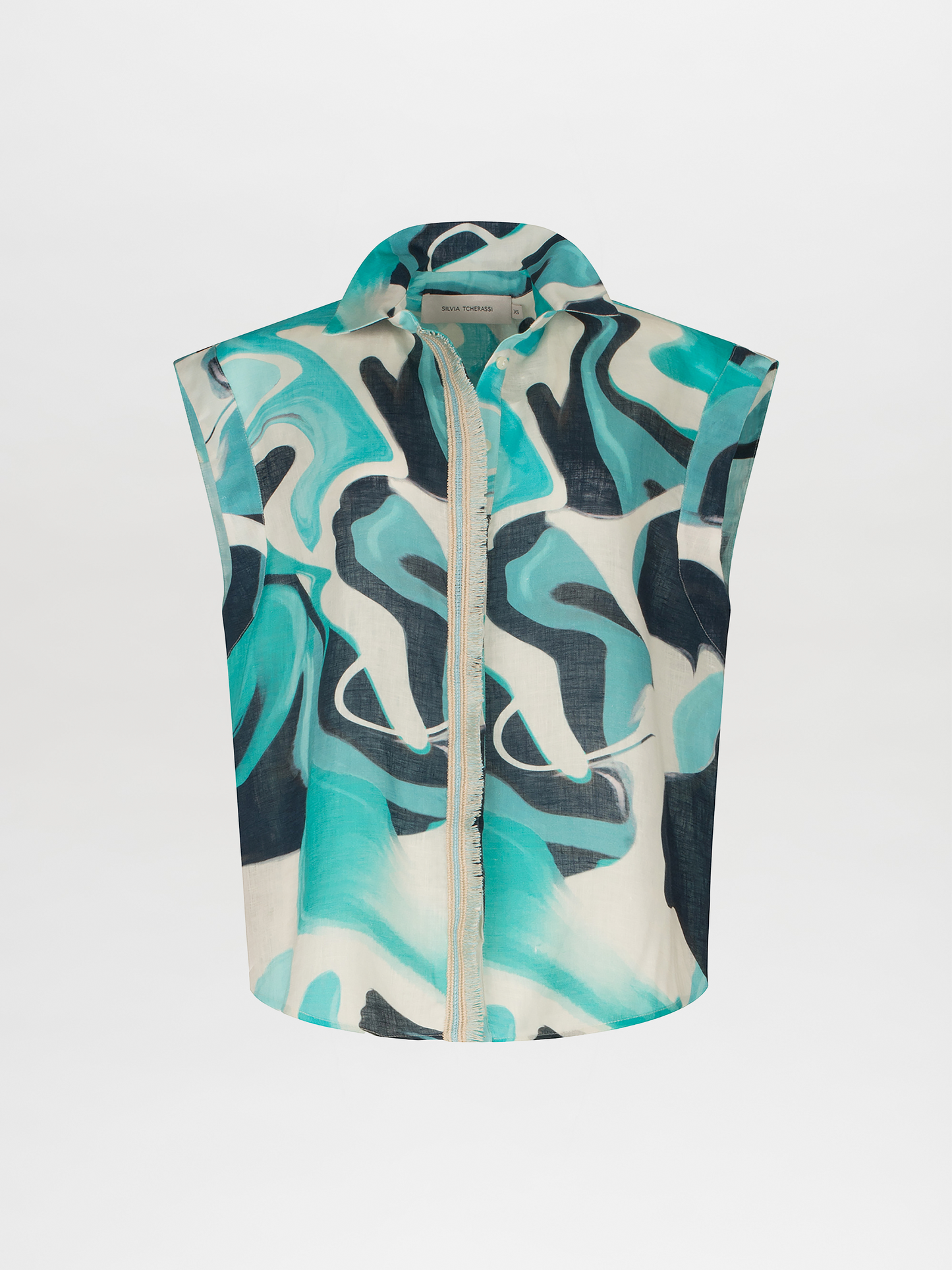 A Rina Blouse Turquoise Marble with a blue and white abstract print.