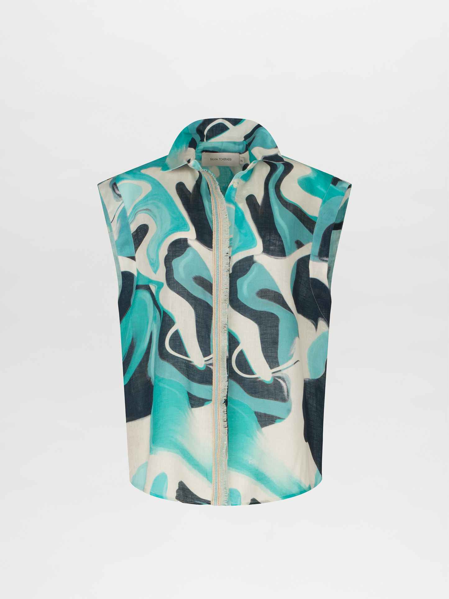 A Rina Blouse Turquoise Marble with a blue and white abstract print.