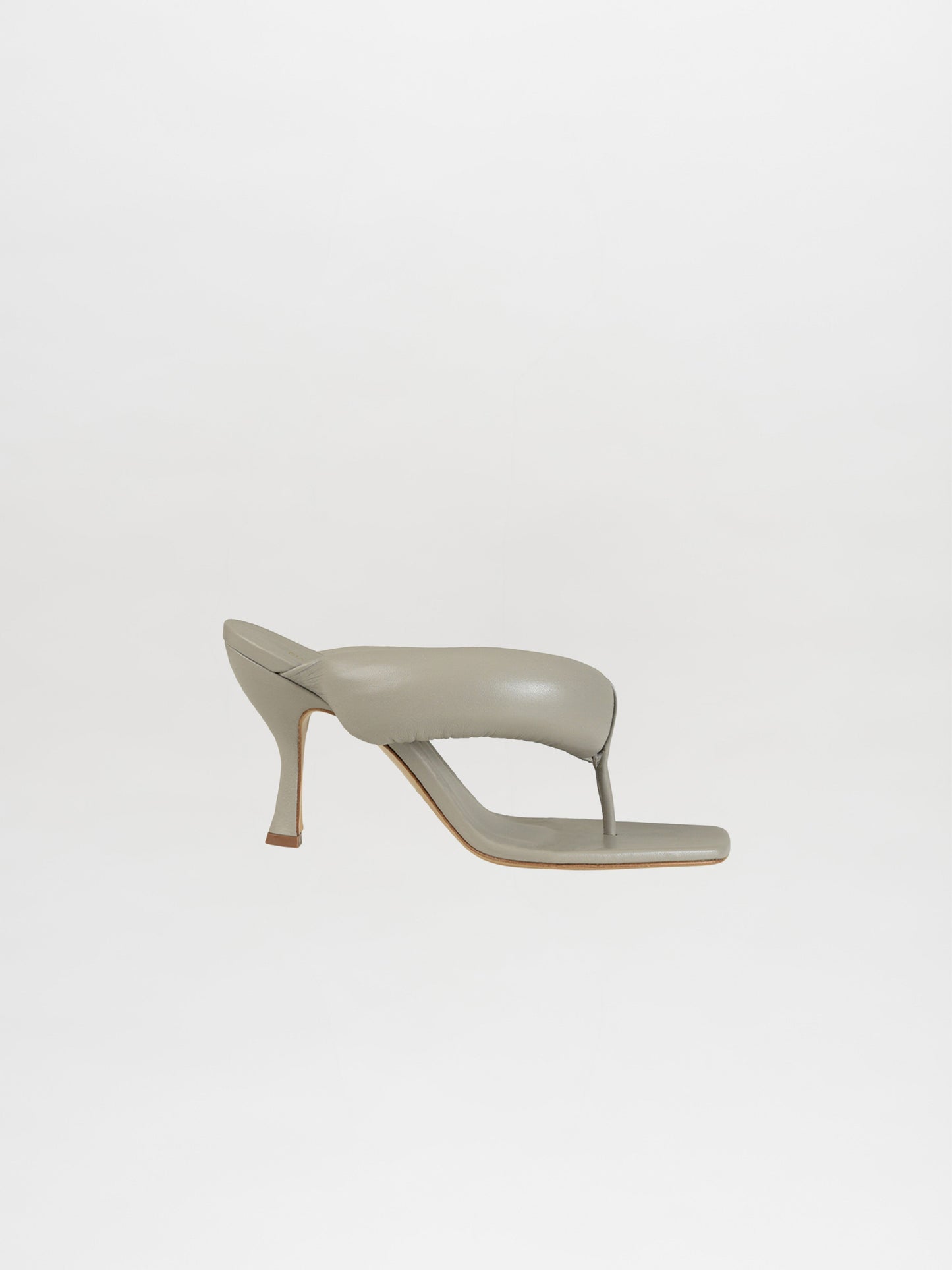 The gray Romito Sandal Cloud features a heeled slip-on design with an open toe and a padded thong upper made from puffy leather, all against a crisp white backdrop.