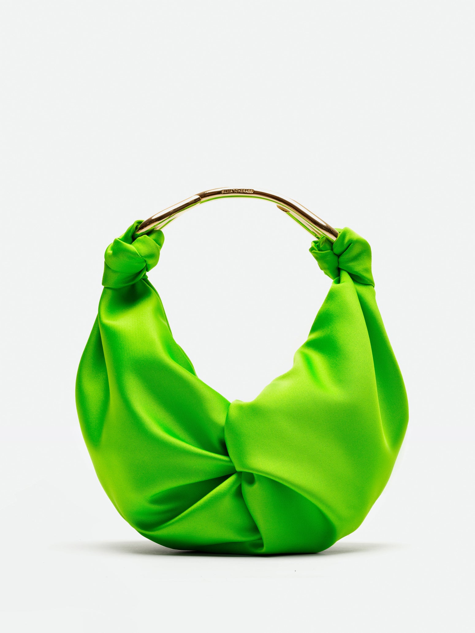 The Sofia Bag Small Kelly is a vivid green, knotted satin handbag featuring luxurious Italian textile and a circular gold handle, displayed on a plain white background.