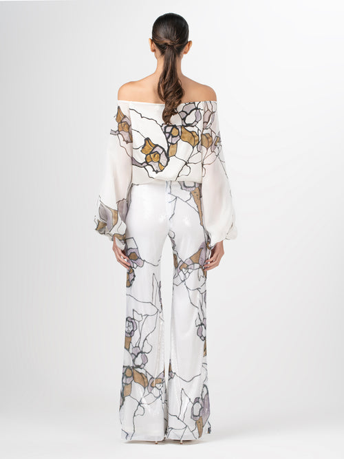 An Aimar Blouse Ecru Marble with silk fabric and an abstract pattern.
