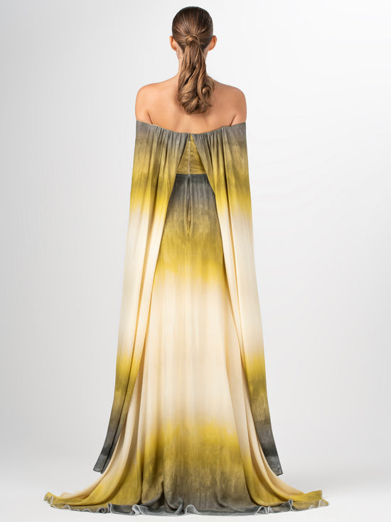 A yellow Cailin Dress Amber Watercolor with a cape and an invisible zipper.
