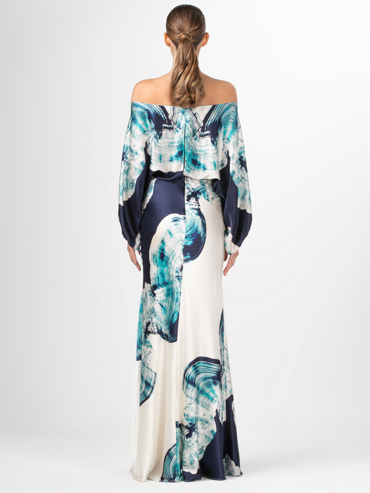 An elegant off-the-shoulder Rossi Dress Navy Abstract Wave featuring a blue and white abstract print on silk fabric.