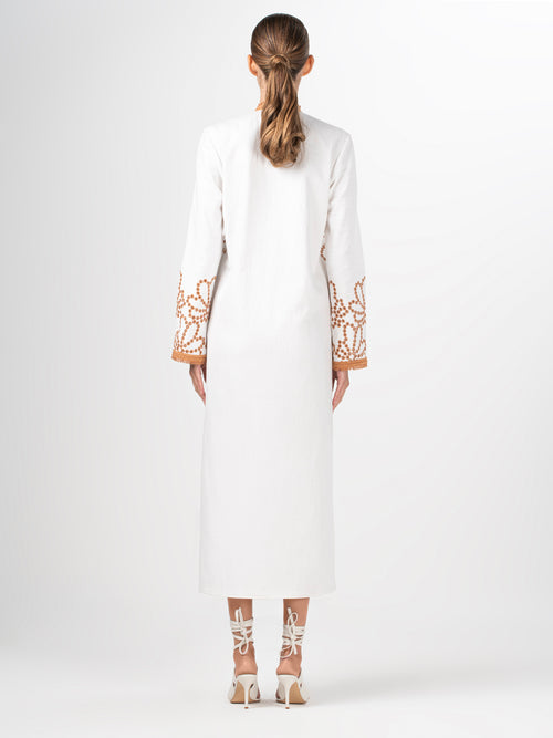 A Bernice Tunic White Cacao Eyelet dress with floral embroidery and embroidered eyelet contrast.