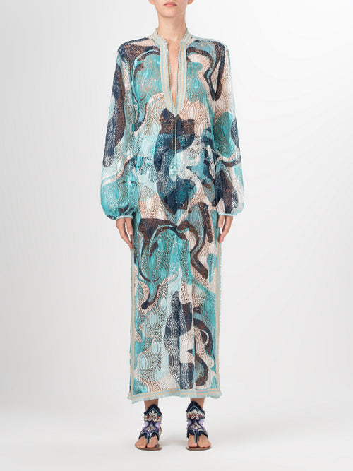 A long Akira Tunic Turquoise Marble with a multicolor abstract print.