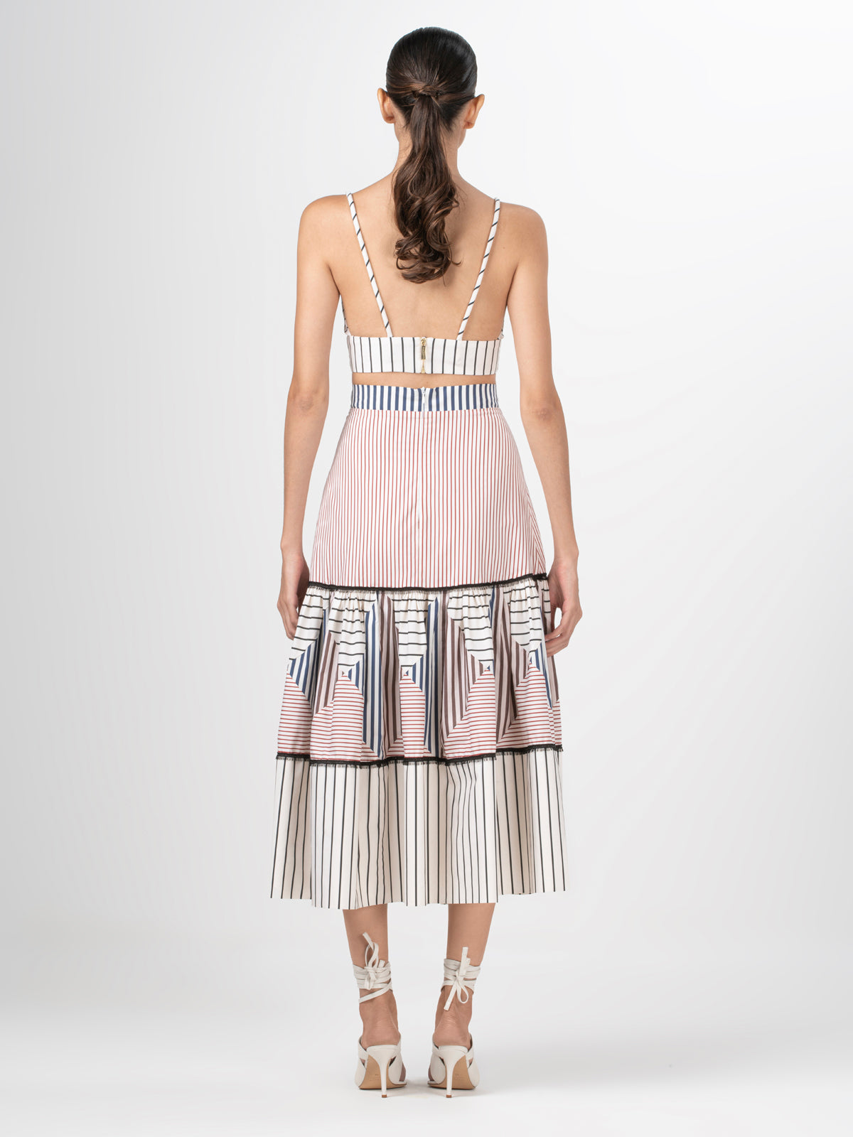 A Guillermina Skirt Multicolor Stripes with high waisted skirt with contrasting black and white stripes.