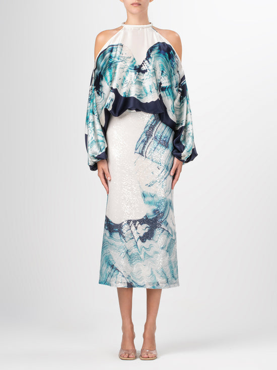 A high-waisted midi Blair Skirt Navy Abstract Wave in blue and white sequins fabric with an abstract print of waves.