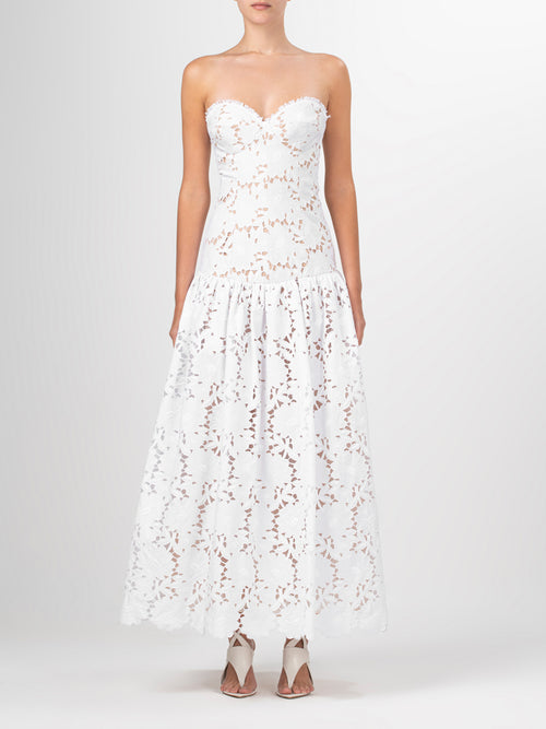 A Margie Dress White with delicate lace detailing.