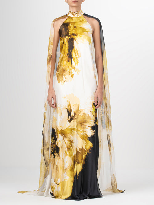 A Sabina Dress Golden Peony with sequins detailing on an abstract print.