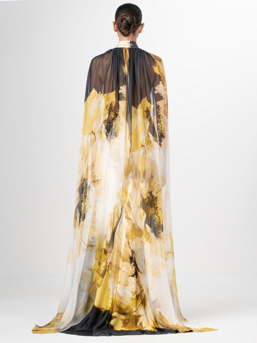 A Sabina Dress Golden Peony with sequins detailing on an abstract print.
