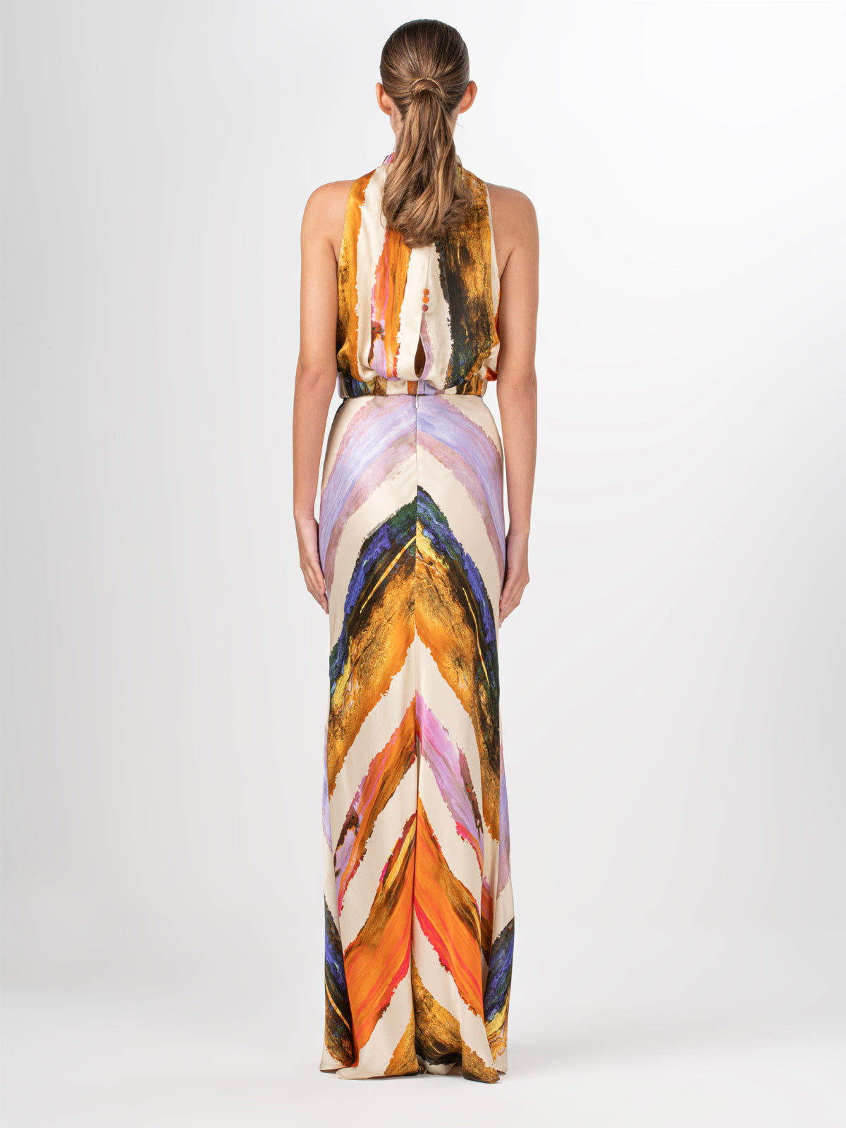 A high waisted Laurina Skirt Orange Orchid Abstract Stripes with a multicolored chevron print.