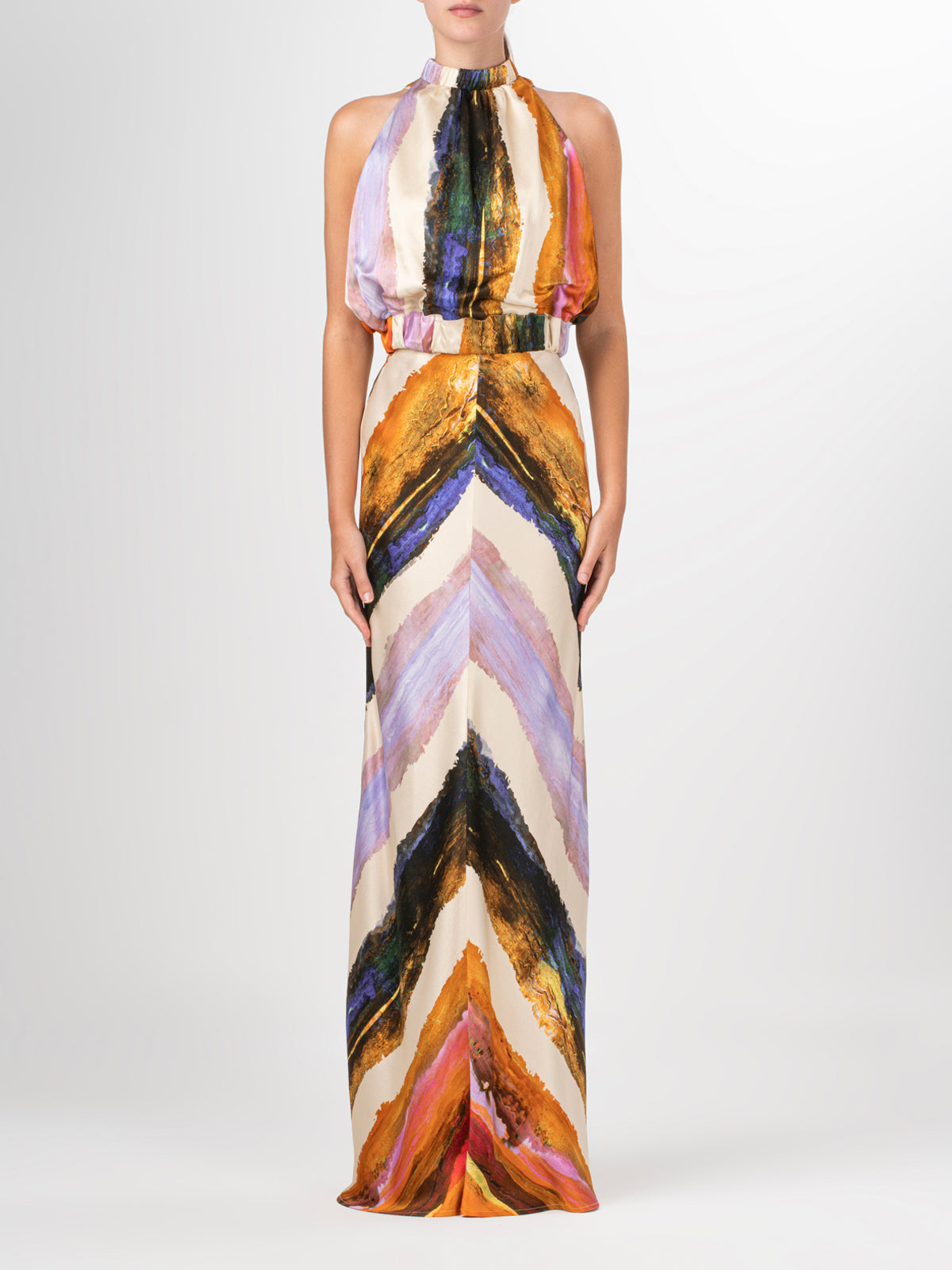 A high waisted Laurina Skirt Orange Orchid Abstract Stripes with a multicolored chevron print.