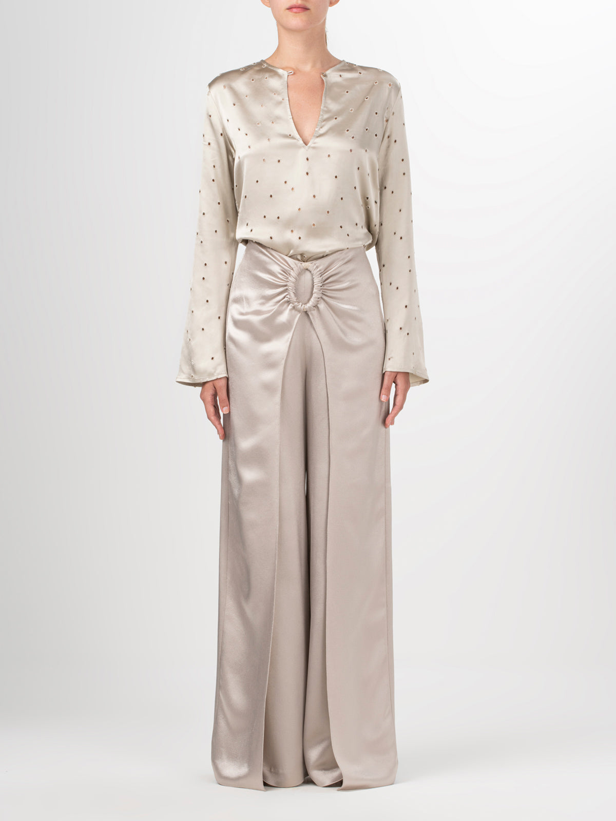 Beige high-waisted Belma Pant Ecru with a bow at the waist, featuring a wide leg silhouette.