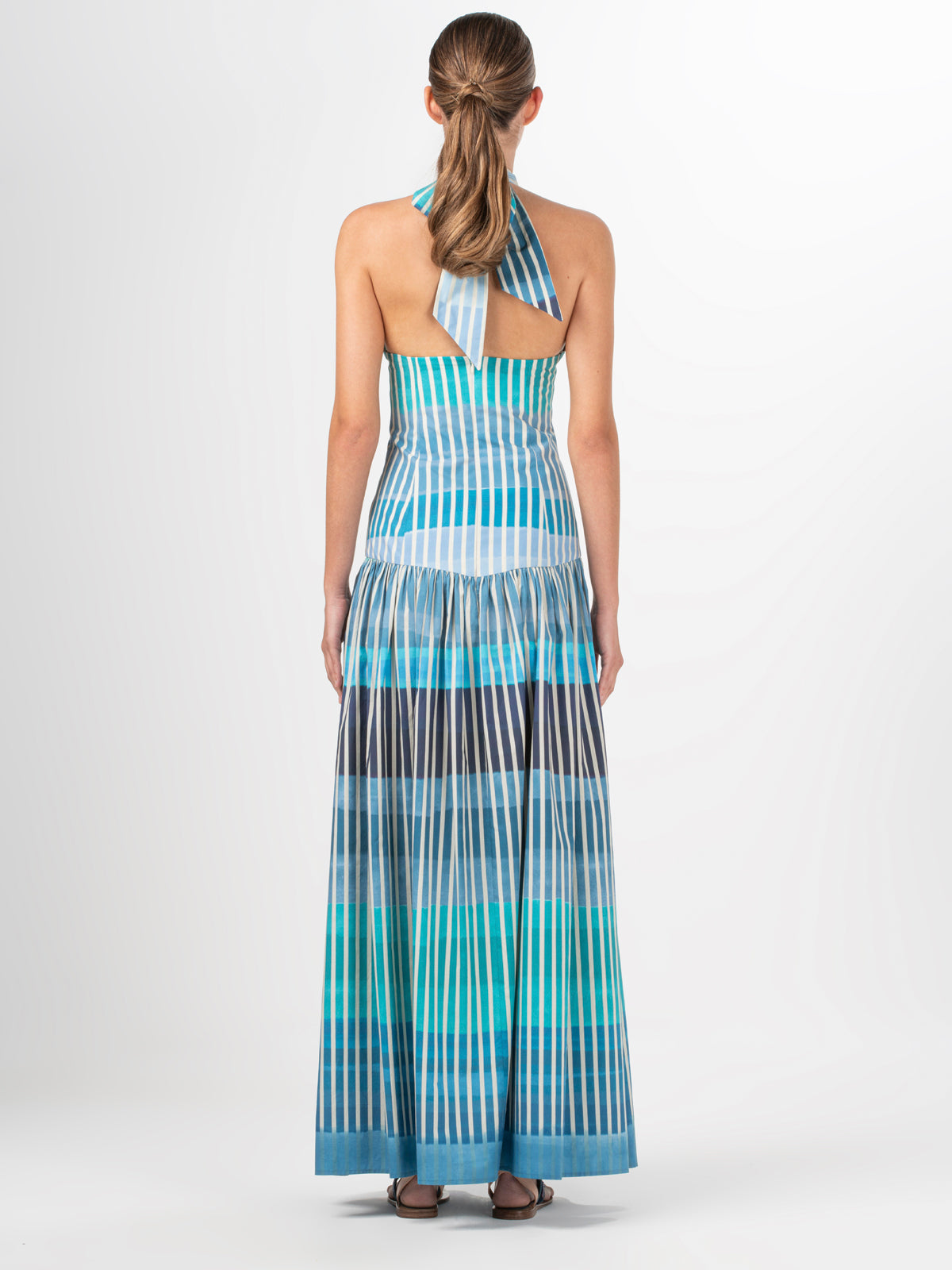 A Traviata Dress Infinite Blue Stripes on a white background.