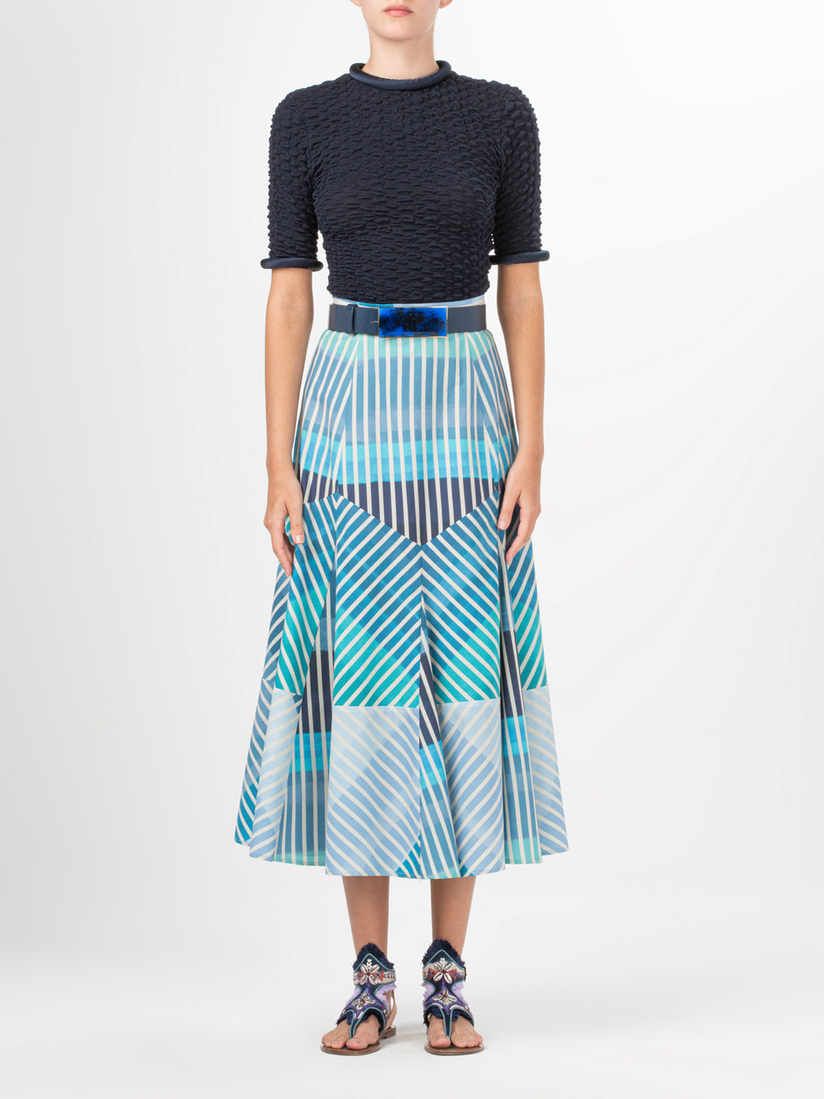 A Madaini Skirt Infinite Blue Stripes with a multicolor stripe pattern.