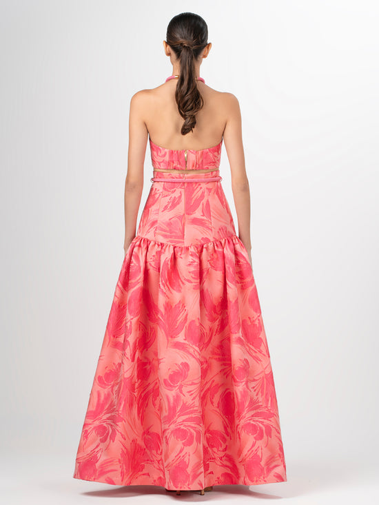 A Teodora Skirt Fuchsia Pink with a bow at the waist in textured jacquard fabric.