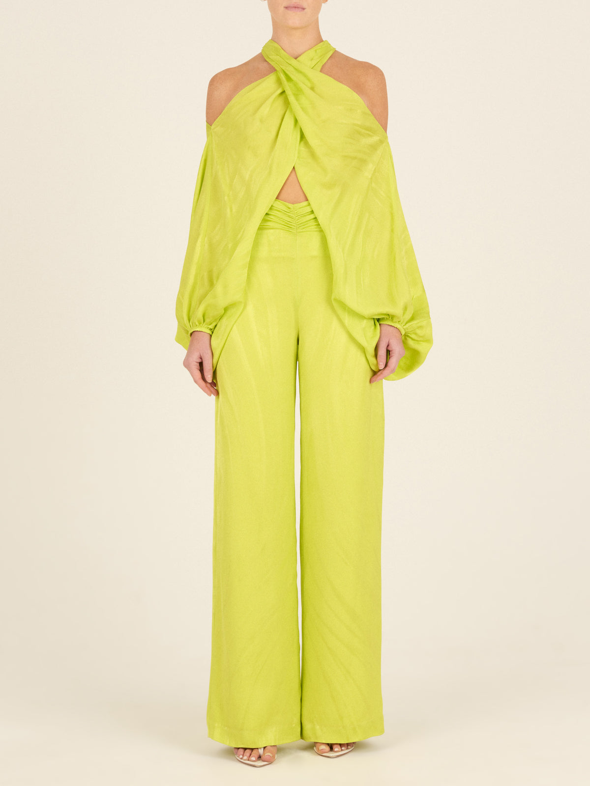 A woman's Casey Pant Verde Lime, wide-leg, flattering drape pants.