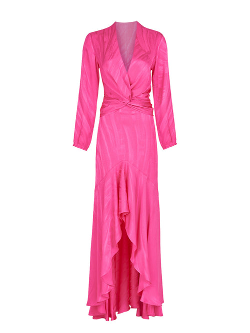 The Albarella Dress Fuchsia features long sleeves, a floor-length hem, and a V-neck, with elegant ruching that creates a waist-slimming silhouette.