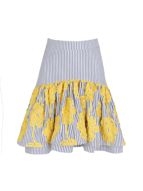 Introducing the Buccan Skirt, a blue and white striped mini-skirt featuring a ruffled hem, beautifully decorated with large yellow floral appliques and detailed embroidered floral designs.