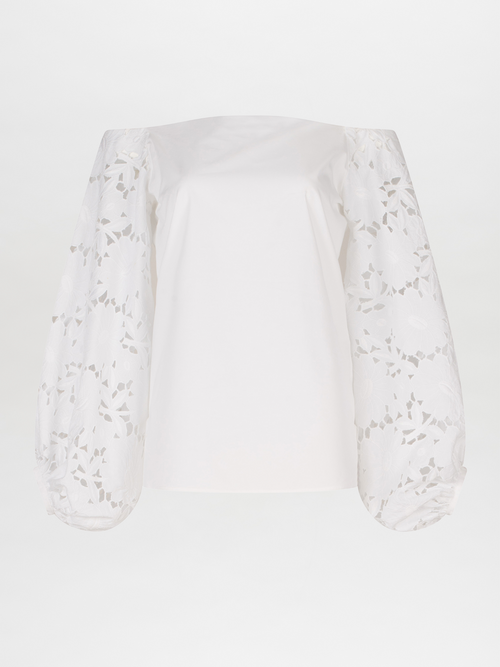 A white Stephanie Blouse White with lace bishop sleeves.