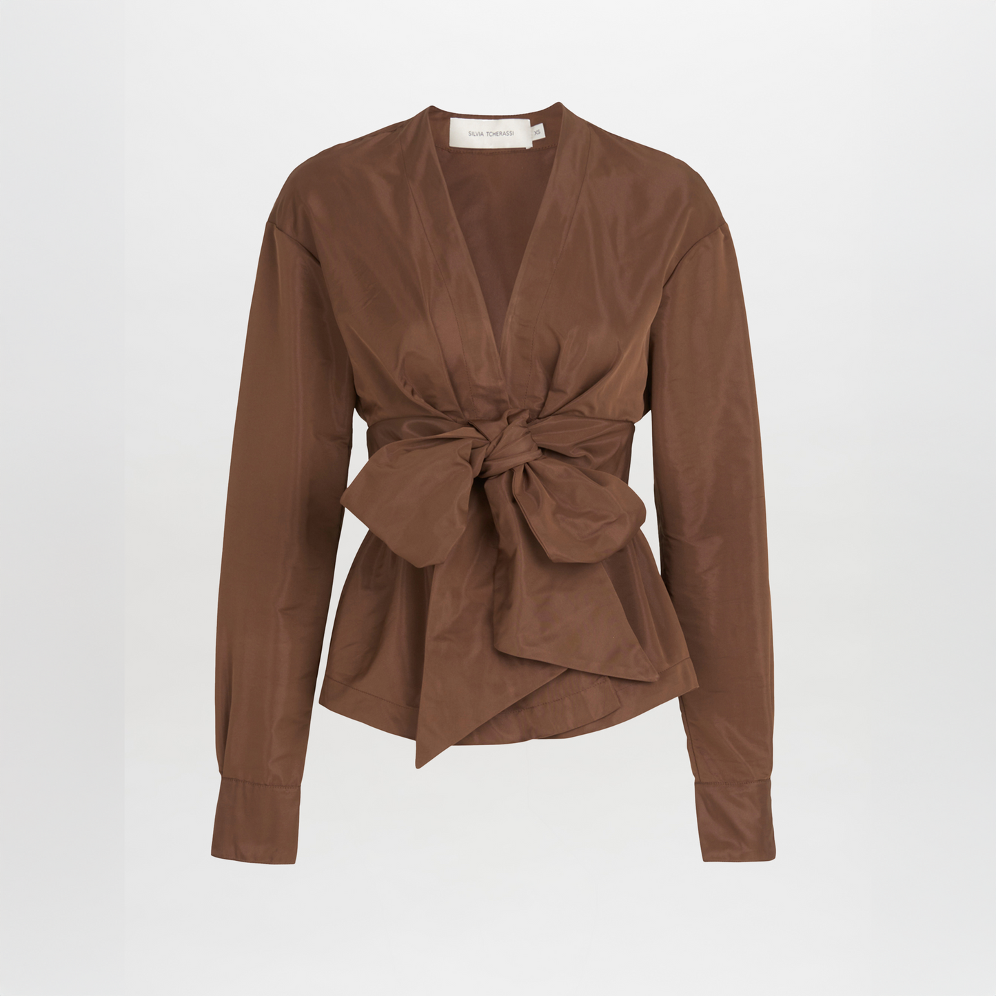 A brown blouse with a bow on the front, in the Saanvi Blouse Brown style.