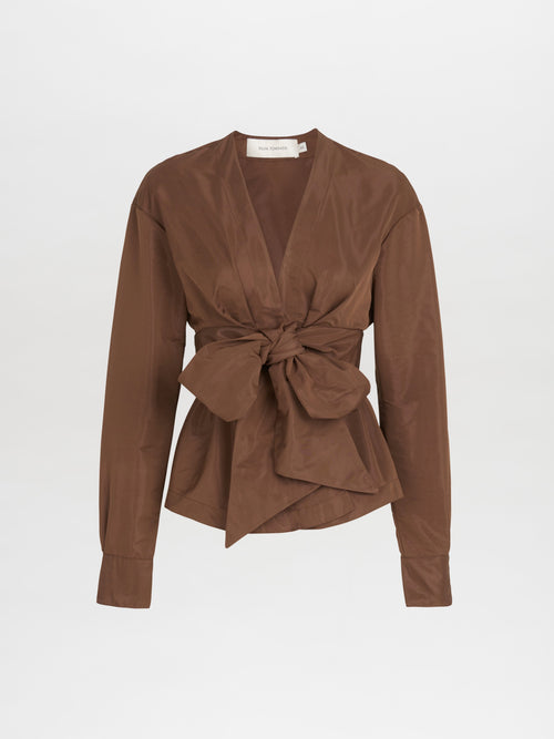 A brown blouse with a bow on the front, in the Saanvi Blouse Brown style.