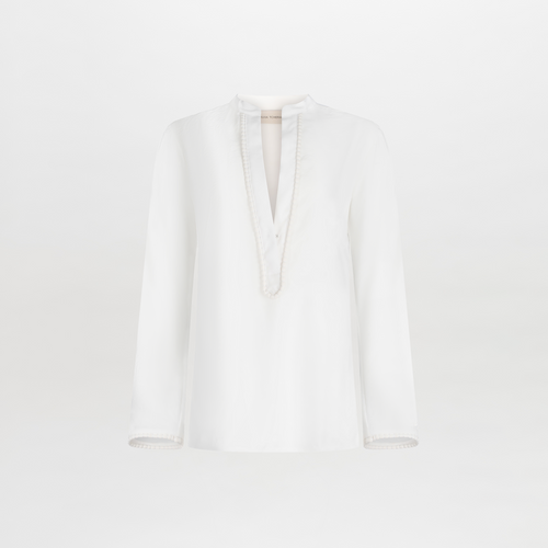 Shera Blouse White with a v-neckline and long sleeves, displayed on a plain background.