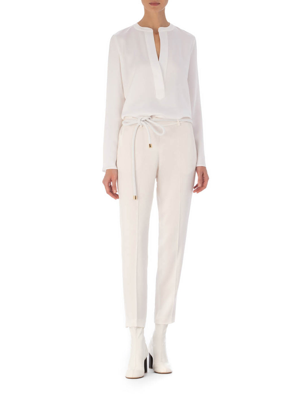 A pair of Bernie Pant White on a plain background.