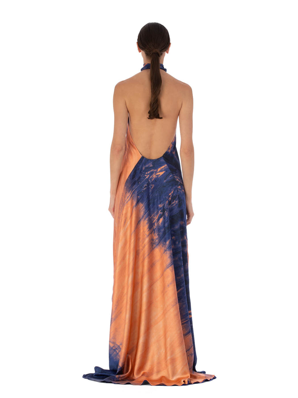Elegant sleeveless Sherry Dress Mediterranean Coral Blue gown with a halter neckline, featuring a gradient blue and orange tie-dye design, displayed against a white background.