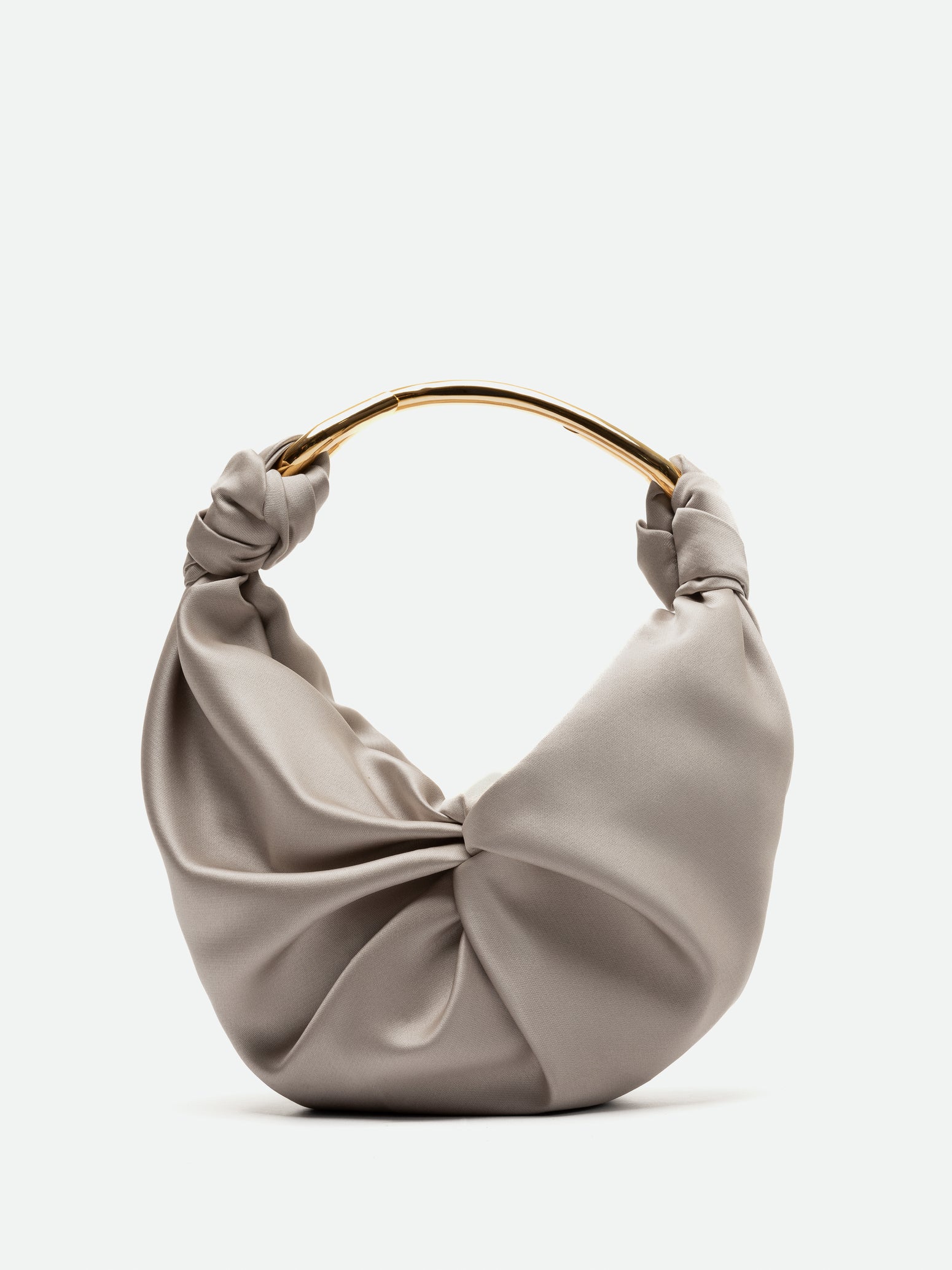 A beige satin handbag with a soft, ruched design and a gold metal handle. This elegant piece is available for pre-order and will ship between November 15 and December 15. The background is plain white.

Replace "beige satin handbag" with "Sofia Bag (Small) Beige":
The Sofia Bag (Small) Beige with a soft, ruched design and a gold metal handle. This elegant piece is available for pre-order and will ship between November 15 and December 15. The background is plain white.