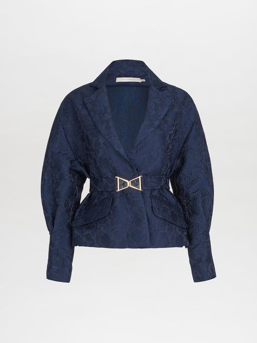 A Sorrento Jacket Navy with a gold buckle.