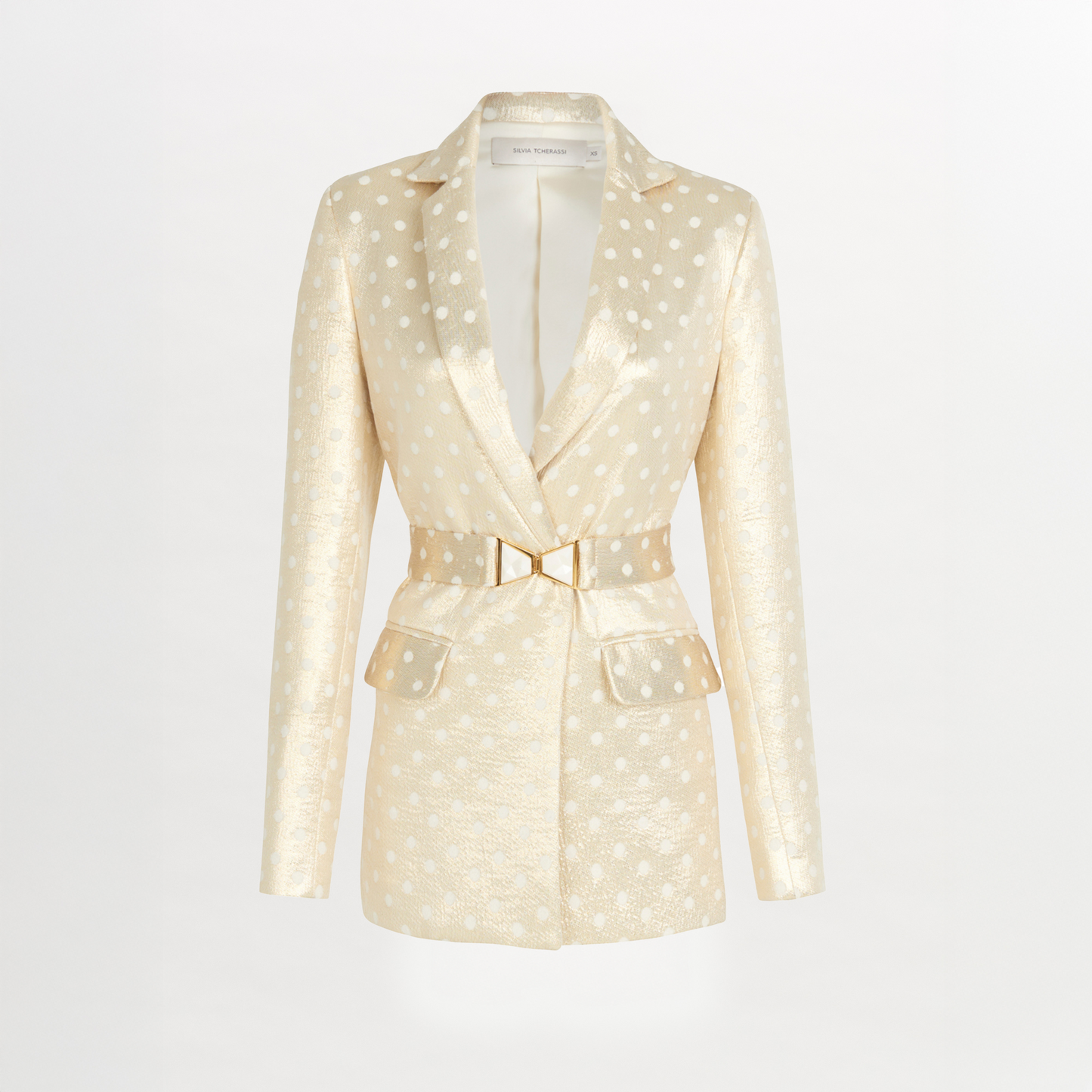 A Sube blazer with polka dots and a gold belt available for Fall 2023.