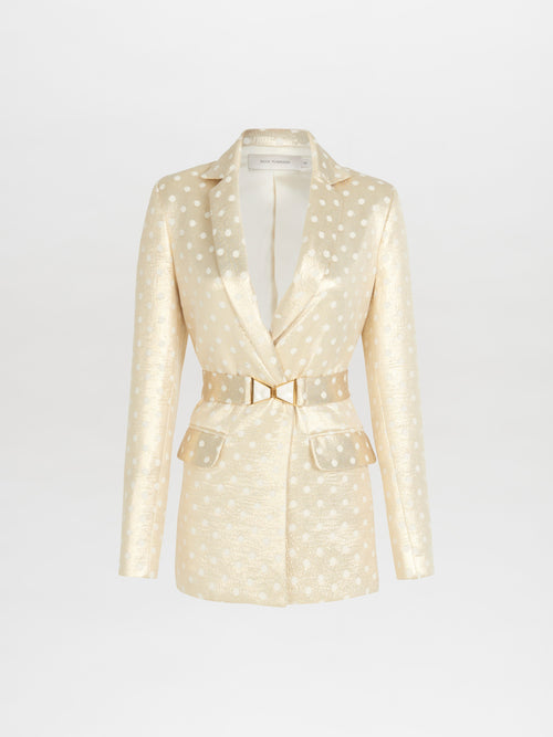 A Sube blazer with polka dots and a gold belt available for Fall 2023.