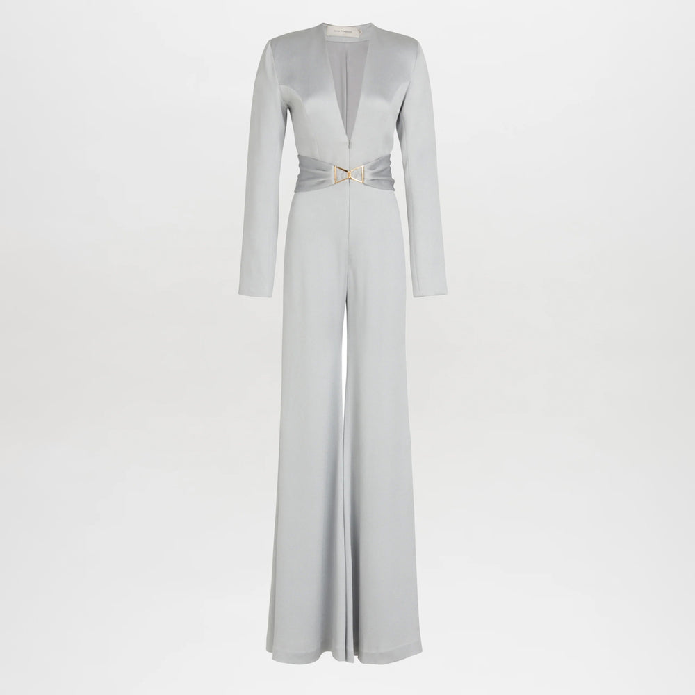 The Taboa Jumpsuit Gray features long sleeves, wide legs, a deep V-neckline, and a cinched waist with a decorative metallic buckle and front belt for a flattering silhouette.