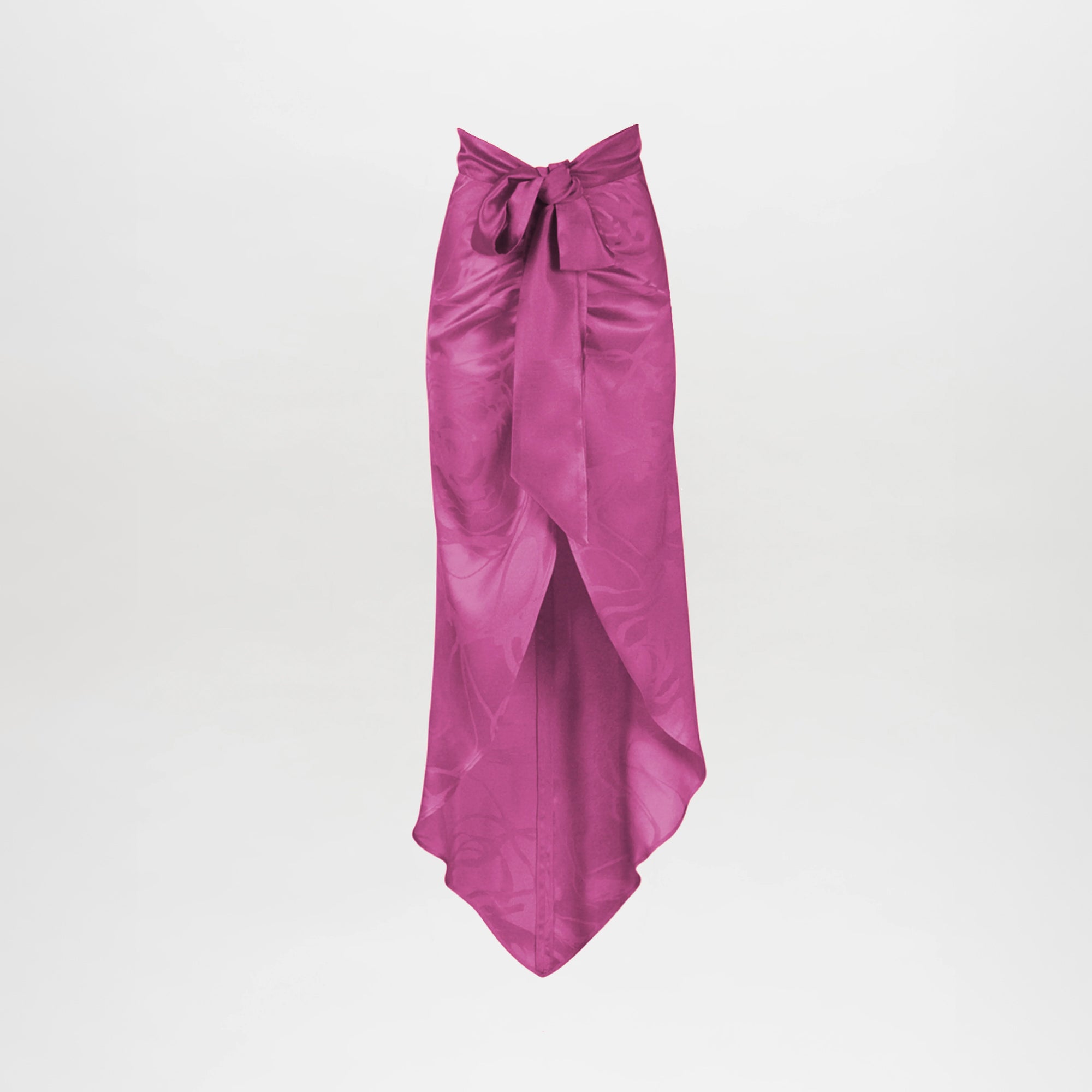 The Tara Skirt Magenta Orchid Jacquard features magenta satin jacquard, a high-low front overlap with a pointed hem, and a wide waist tie bow, displayed on a plain white background.
