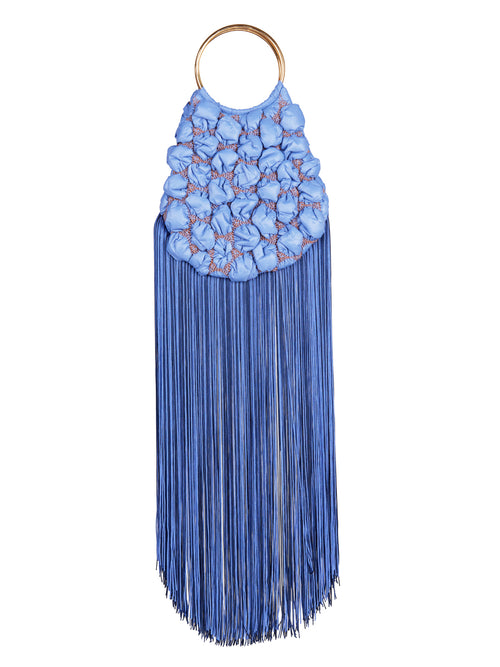 A Toblach Bag Blue with fringes that ships soon after an order is placed.
