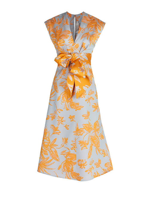 A Toledo Dress Apricot Silver with a grey floral print. Arrives in days.