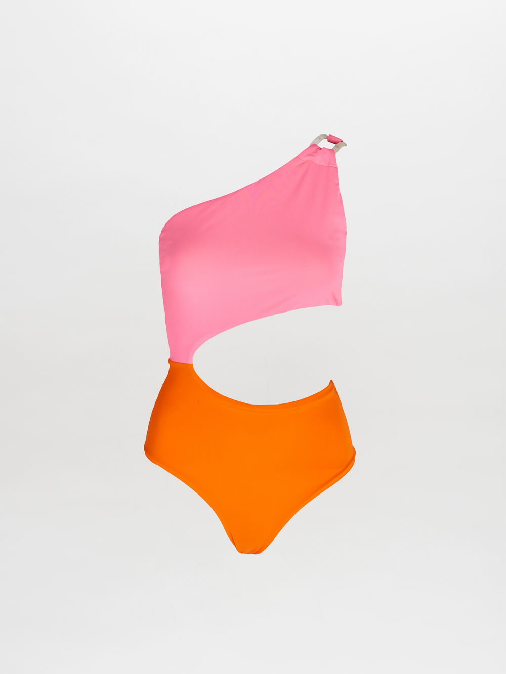 The Tropea One Piece is a color-blocked one shoulder swimsuit with a pink top, orange bottom, and an asymmetrical waist cutout, shown on a plain white background.