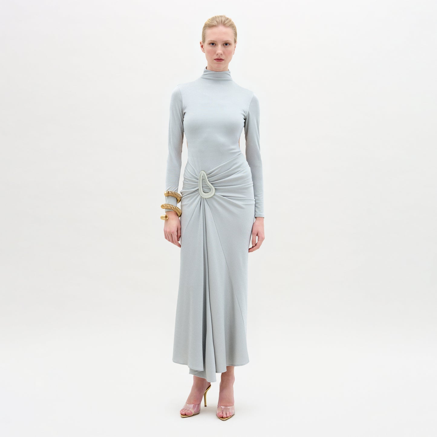 A woman wearing the Venus dress midi-dress in color Silver on a white background.