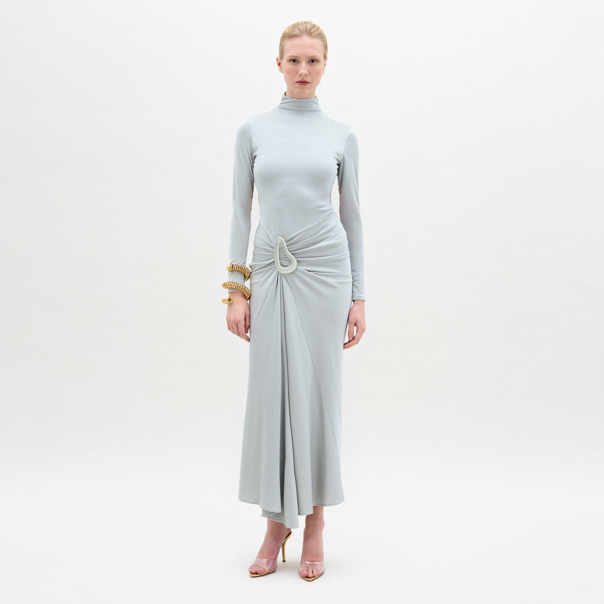 A woman wearing the Venus dress midi-dress in color Silver on a white background.