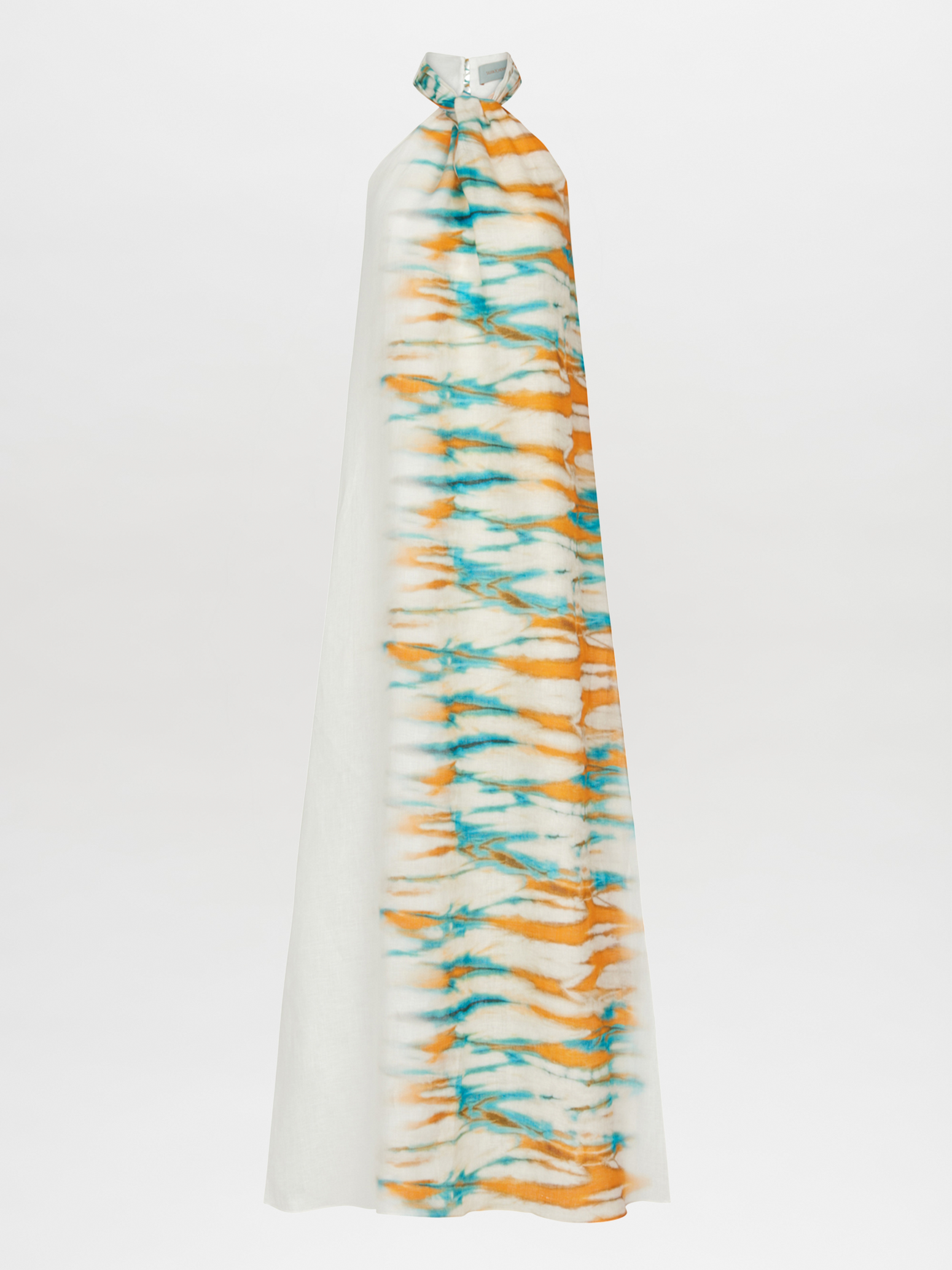 The Belina Dress in Orange/Turquoise is a long, white halter neck dress with an abstract tunic design featuring an orange and turquoise tie-dye pattern down the center.