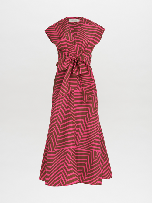 A feminine Toledo Dress Fuchsia Cacao with a bow, perfect for any occasion.