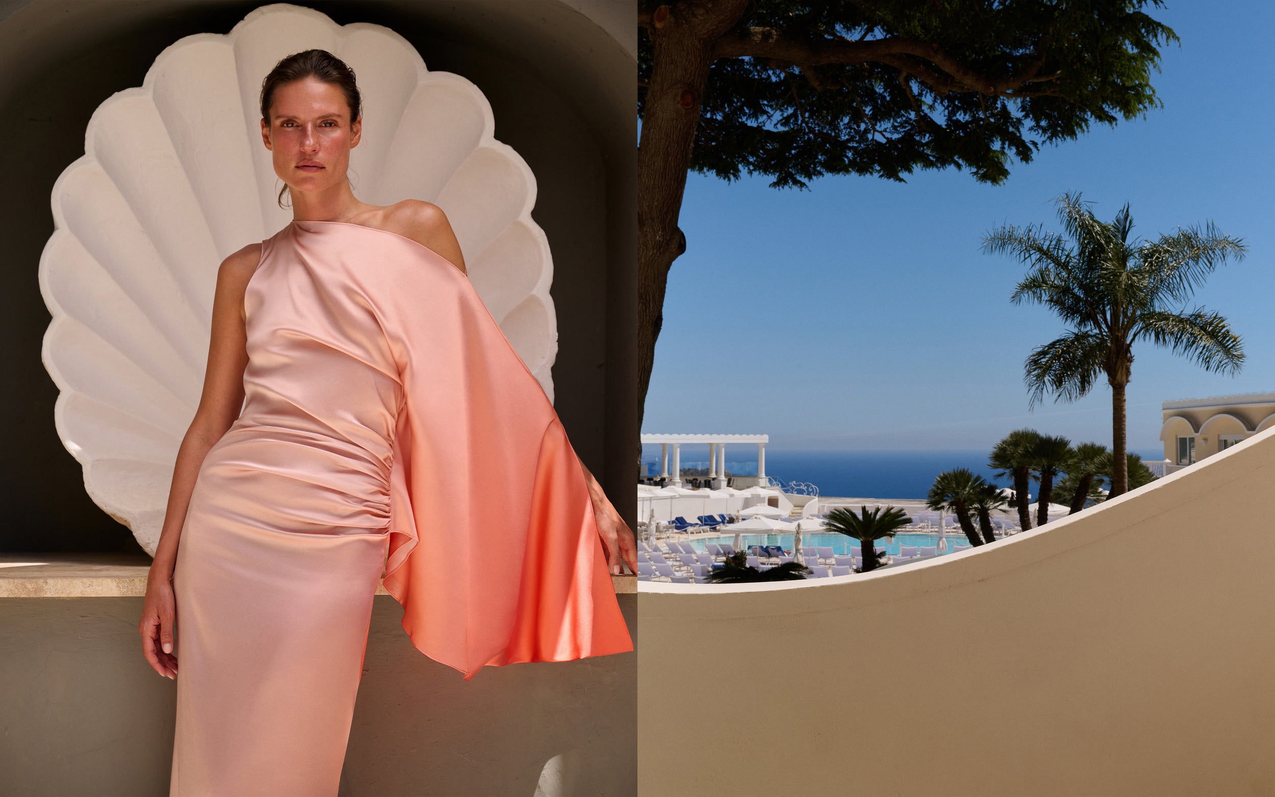 A model wears a one-shoulder peach satin gown with a draped cape-like sleeve, posed in front of a large white scalloped shell wall. The right side of the split image shows an outdoor resort scene with palm trees, a blue ocean, and a beige curved wall in the foreground.