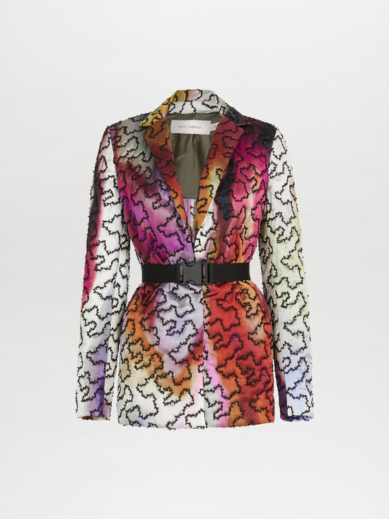 A Yarah Jacket Iridescent Marble with a belt and printed florals.