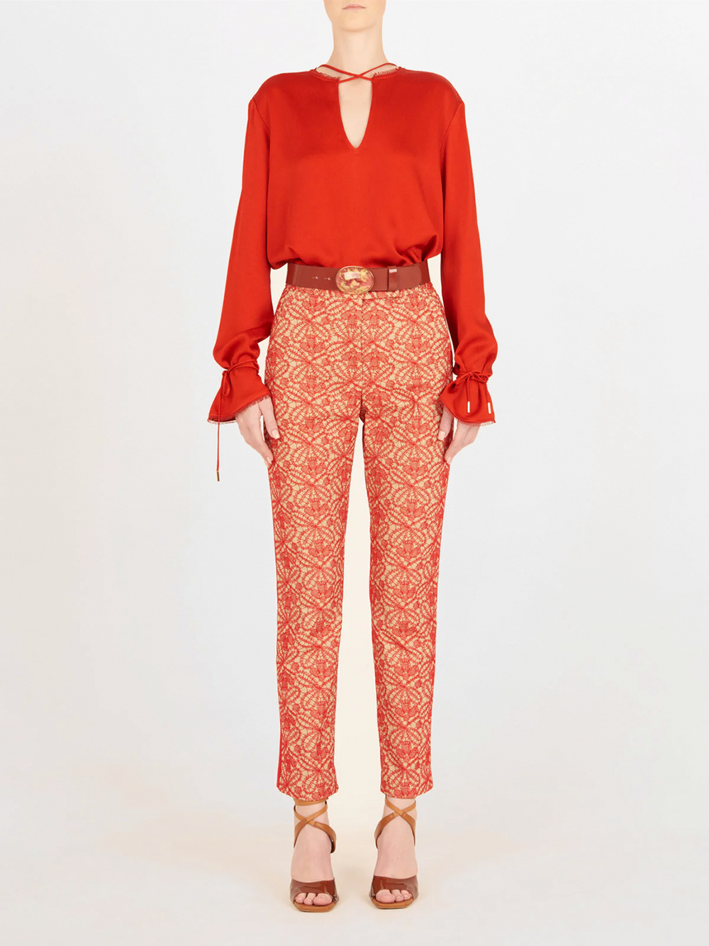 A figure-flattering Zafra Blouse Rouge with lace trim.