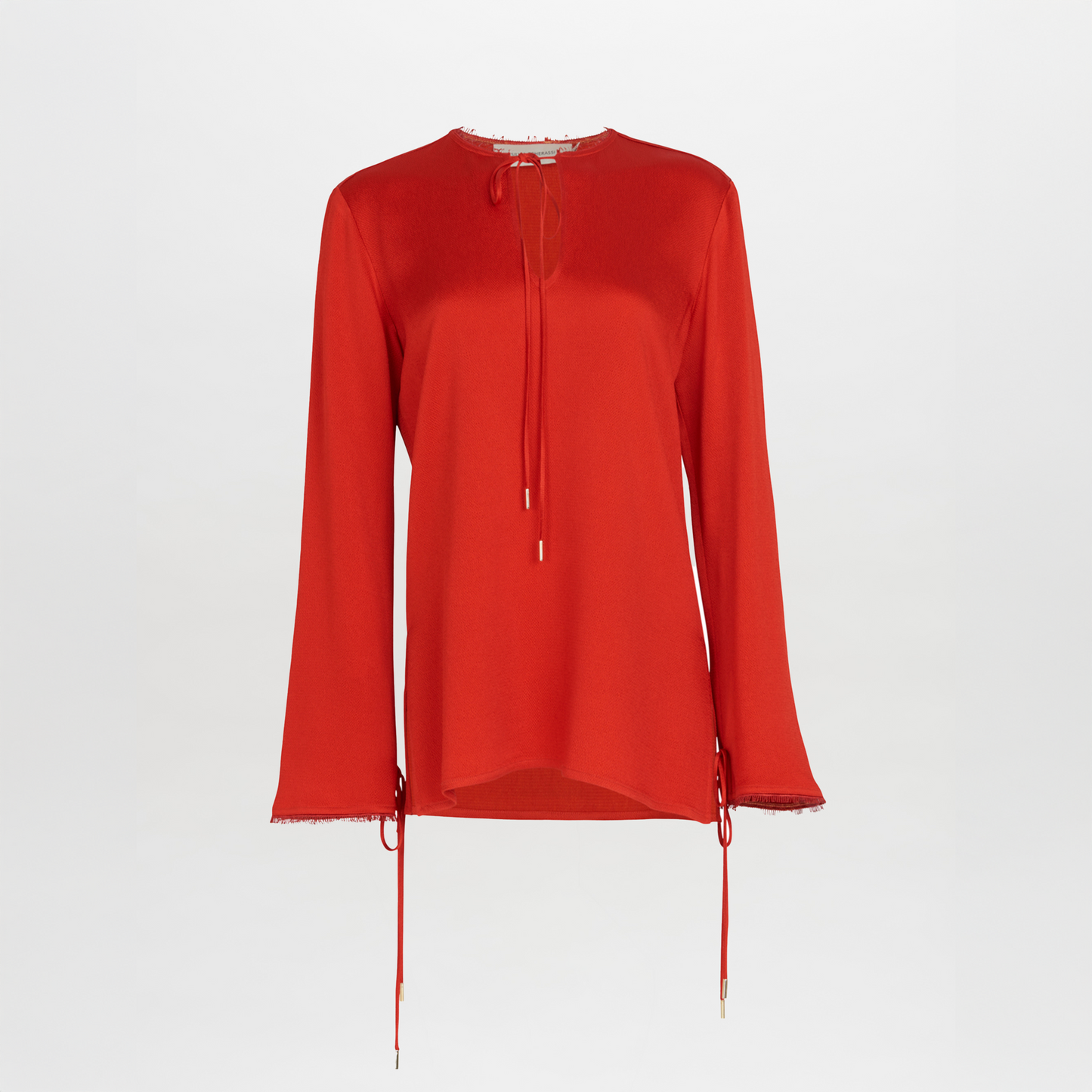 A figure-flattering Zafra Blouse Rouge with lace trim.
