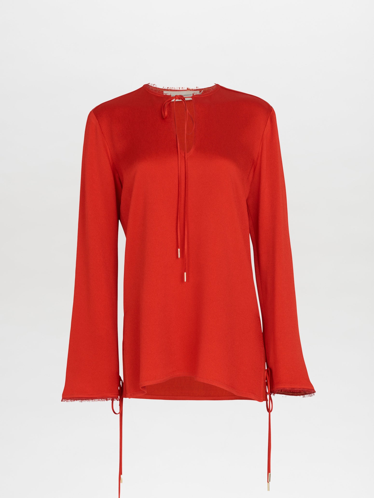 A figure-flattering Zafra Blouse Rouge with lace trim.