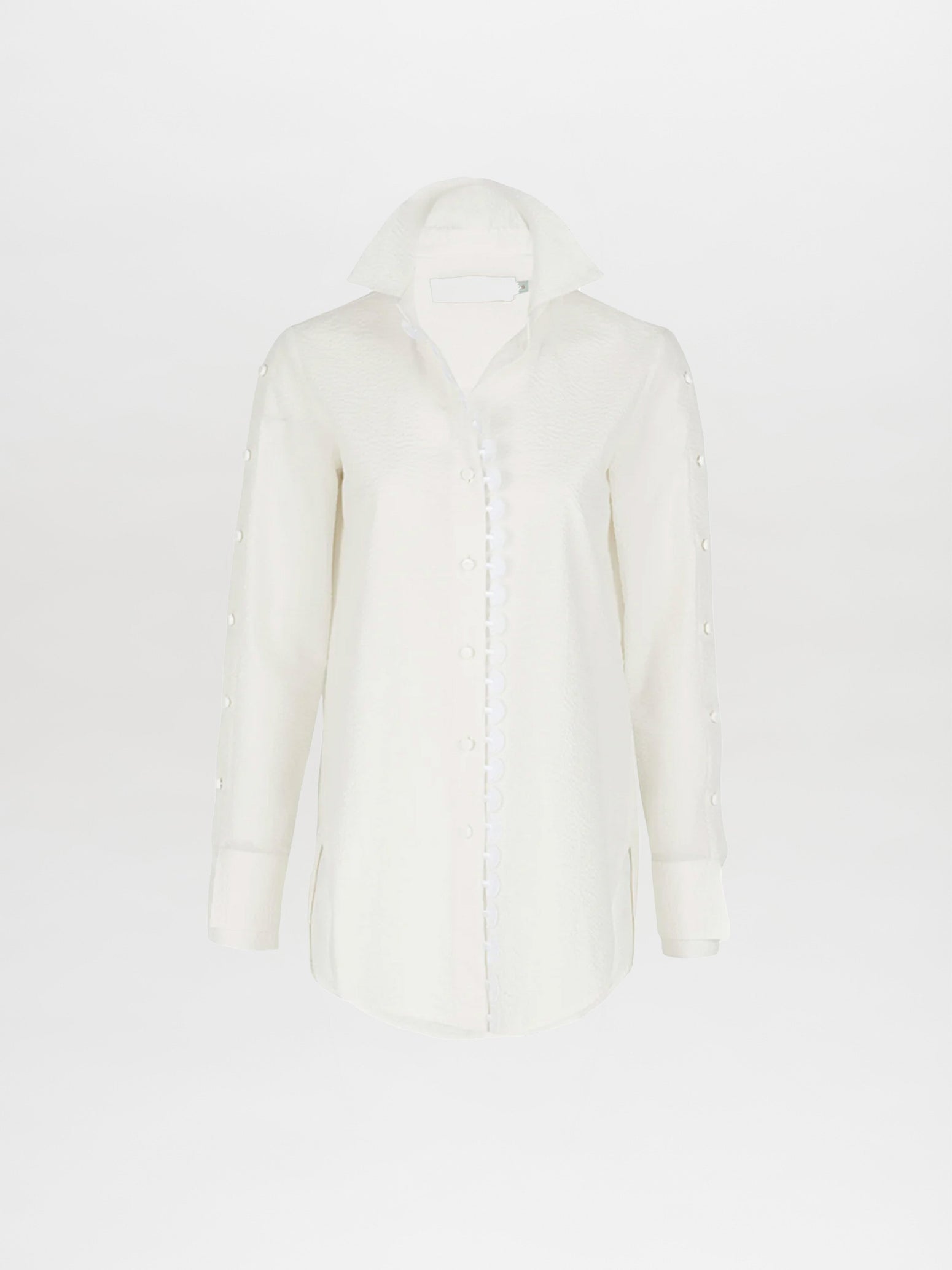 A Premium Blouse White with ruffles on the collar and cuffs, perfect for Spring 2023.