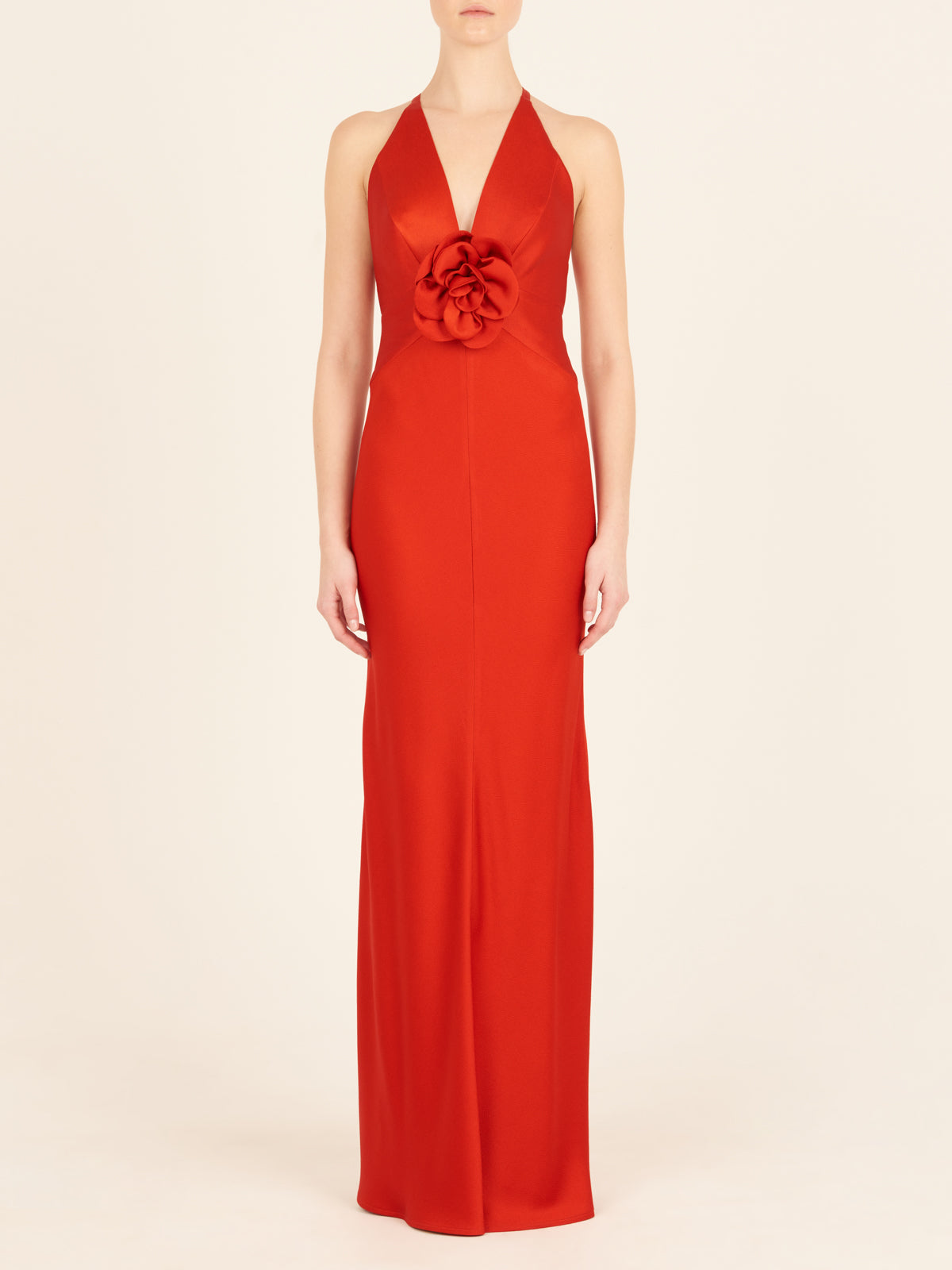 A Daniela Dress Rouge with a halter neck.